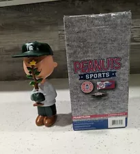 Peanuts Sports, Charlie Brown Christmas Tree Figurine. Holding Christmas Tree.