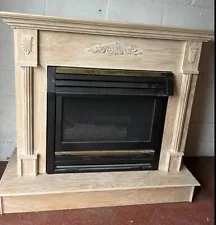 top condition, beautiful beige, wooden fireplace medium size, works on gas