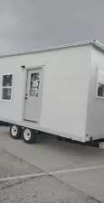 tiny home on wheels.On an 8x16 trailer . Sold as is