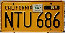 1956 California single black on yellow license plate with a 1962 sticker NTU686