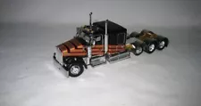 1/64th DCP803 W900L 60” Flattop Sleeper Tri-Axle Black With Gold Strips