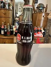 This Sale For 1 W.S.Heath 1996 8 oz Coca Cola Bottle. Very Sought After Bottle.