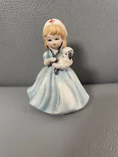 vintage small girl nurse with puppy figurine