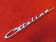 1965 Pontiac Catalina NOS GM Fender Script Emblem # 4528401