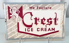 WE FEATURE CREST ICE CREAM 1950's CELLULOID-FOIL MILPRINT VINTAGE DAIRY SIGN OLD