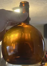 UNUSUAL ROUND AMBER FLASK “PRIVATE MOULD PATENT APPLIED FOR” EMBOSSED ON BOTTOM