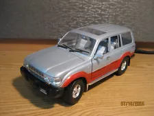 1/18 1992 TOYOTA LAND CRUISER , IN SILVER AND RED BY ROAD TOUGH , NO BOX