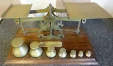 ANTIQUE SET OF BRASS & OAK POSTAL SCALES AND WEIGHTS GOOD CONDITION FOR AGE