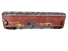 Graffiti, Weathered HO Athearn ACF covered hopper, DuPont