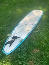 Surfboard = Truant 8 ft longboard WITH leash.